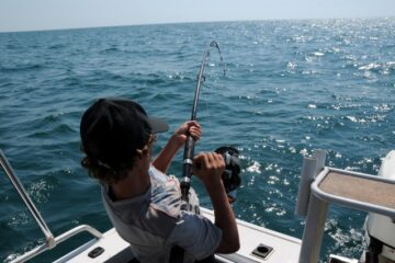 man fishing at sea