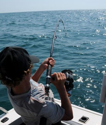 man fishing at sea